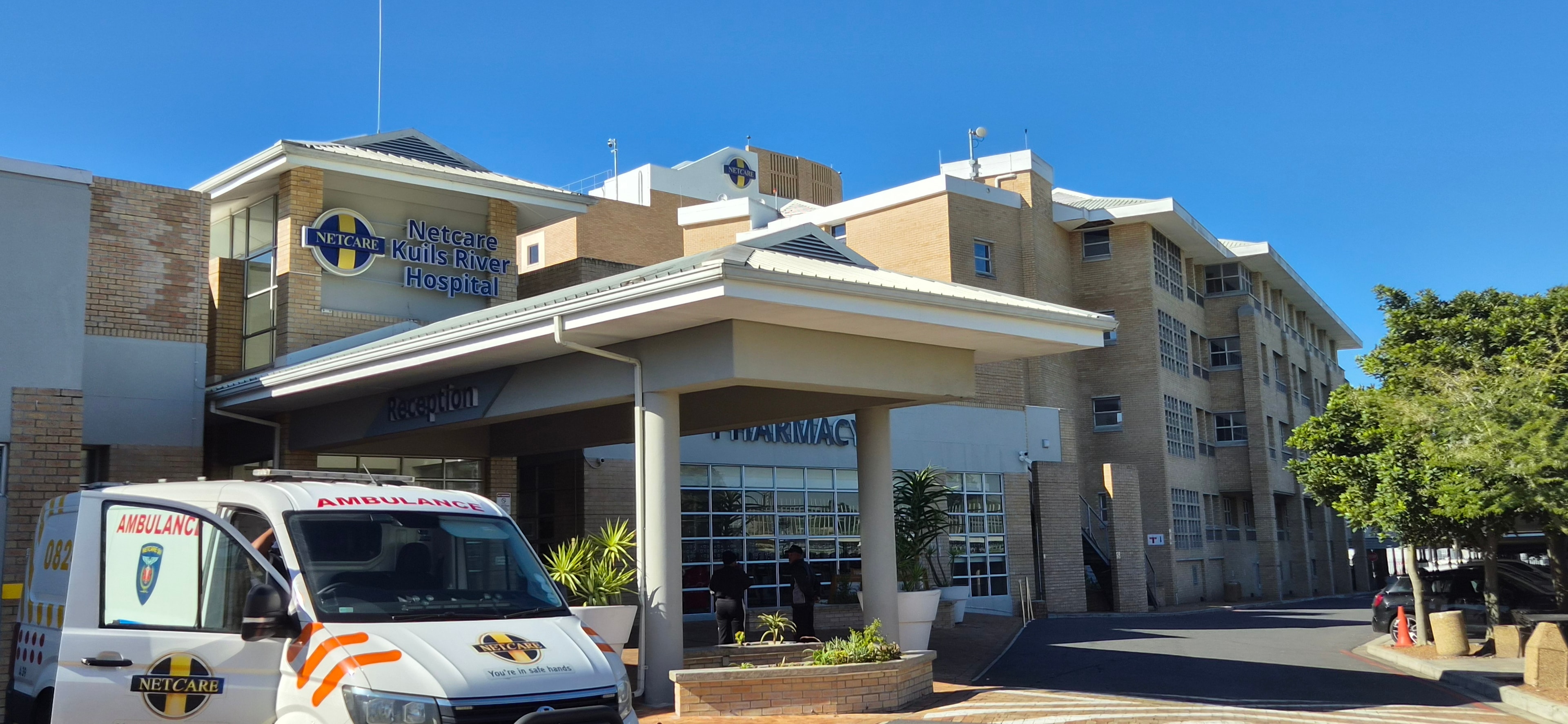 Netcare Kuils River Hospital entrance with ambulance